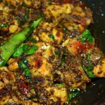 Spicy and flavorful Mutton Pepper Fry cooked with black pepper, curry leaves, and aromatic spices.